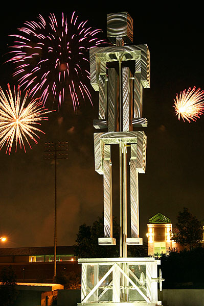Kinetic Man in front of Hammons Stadium highlighted by weekend fireworks